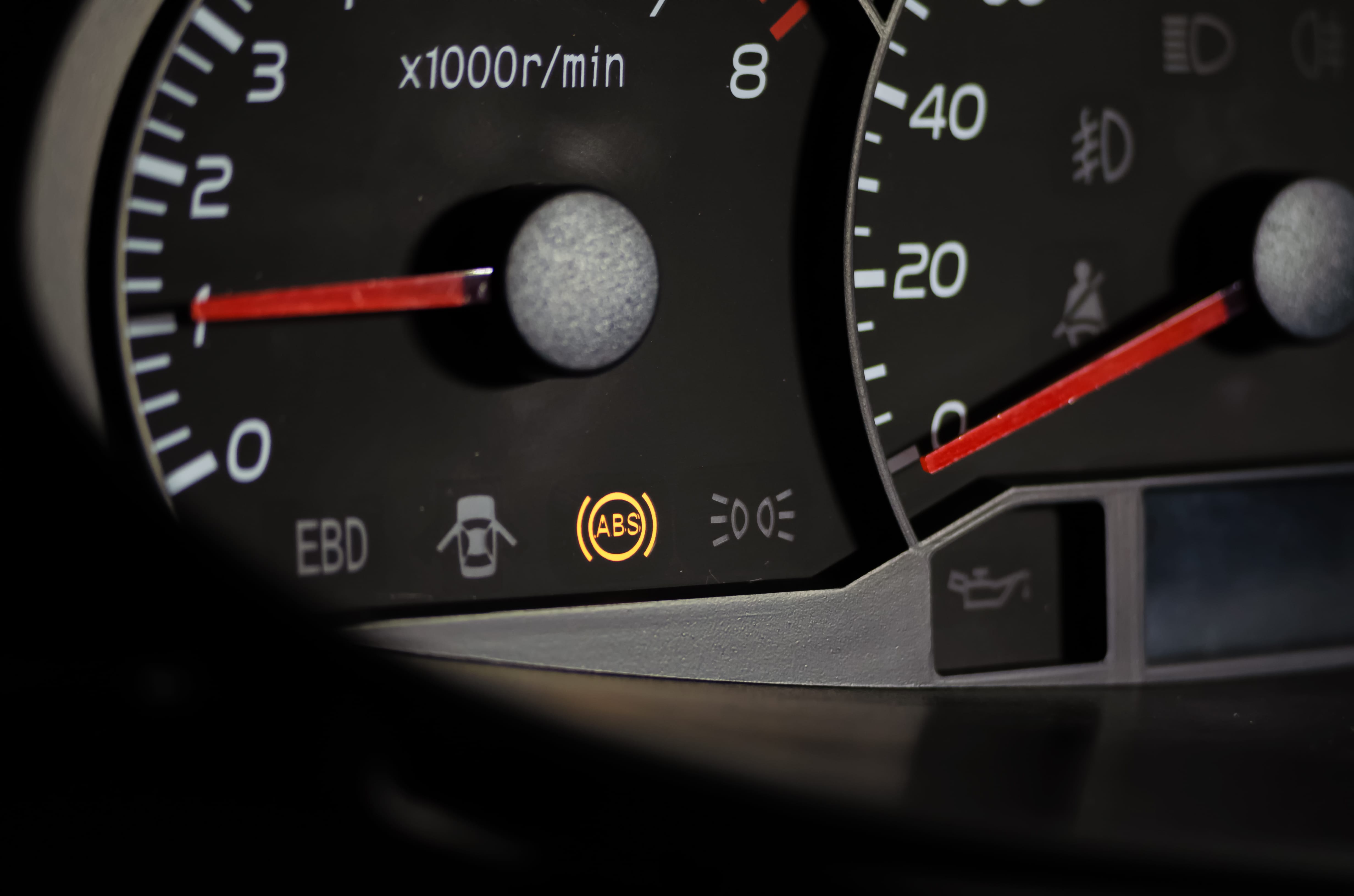 The ABS sensor lights up orange in the car dashboard.