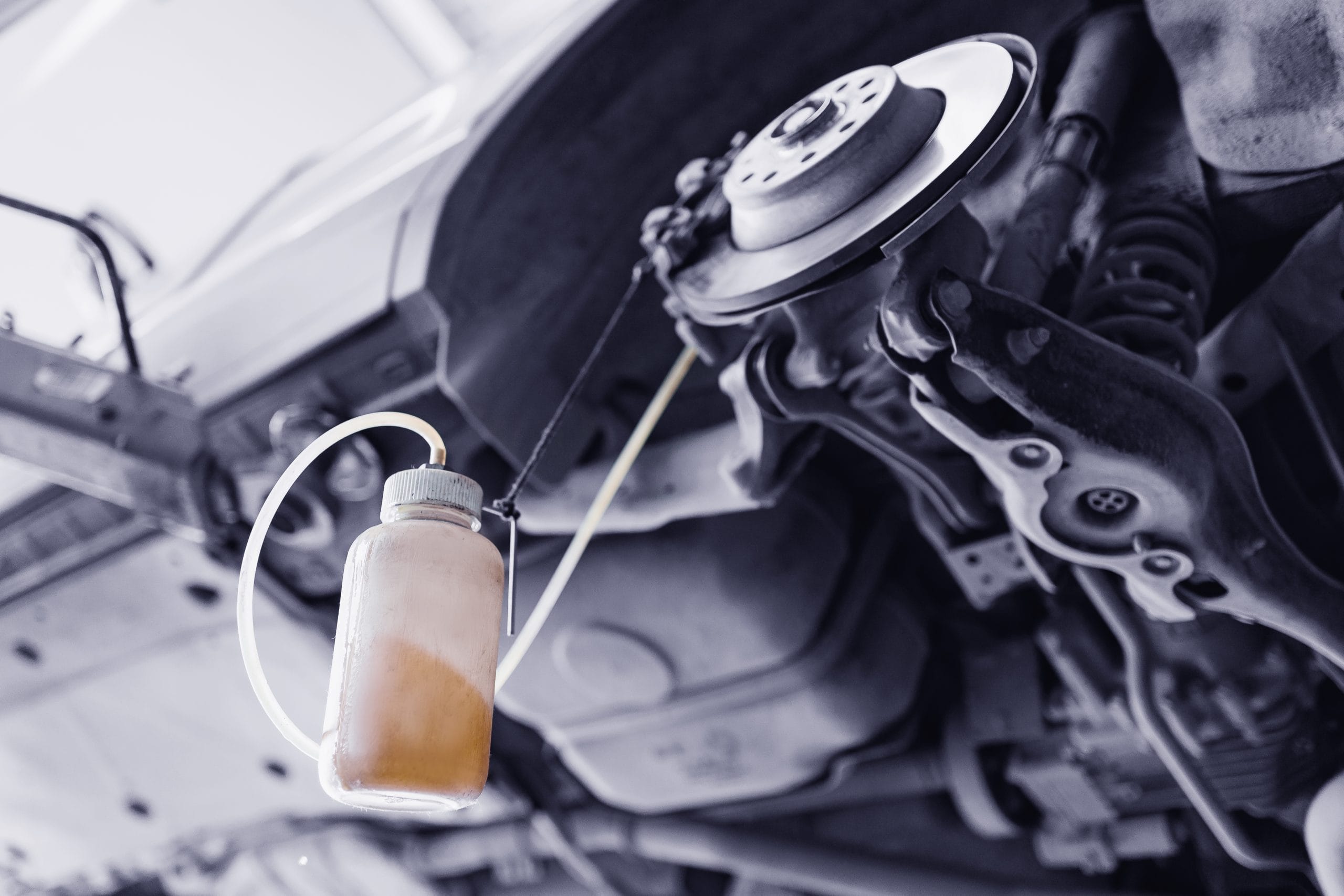 Car service, closeup process changing brake fluid.