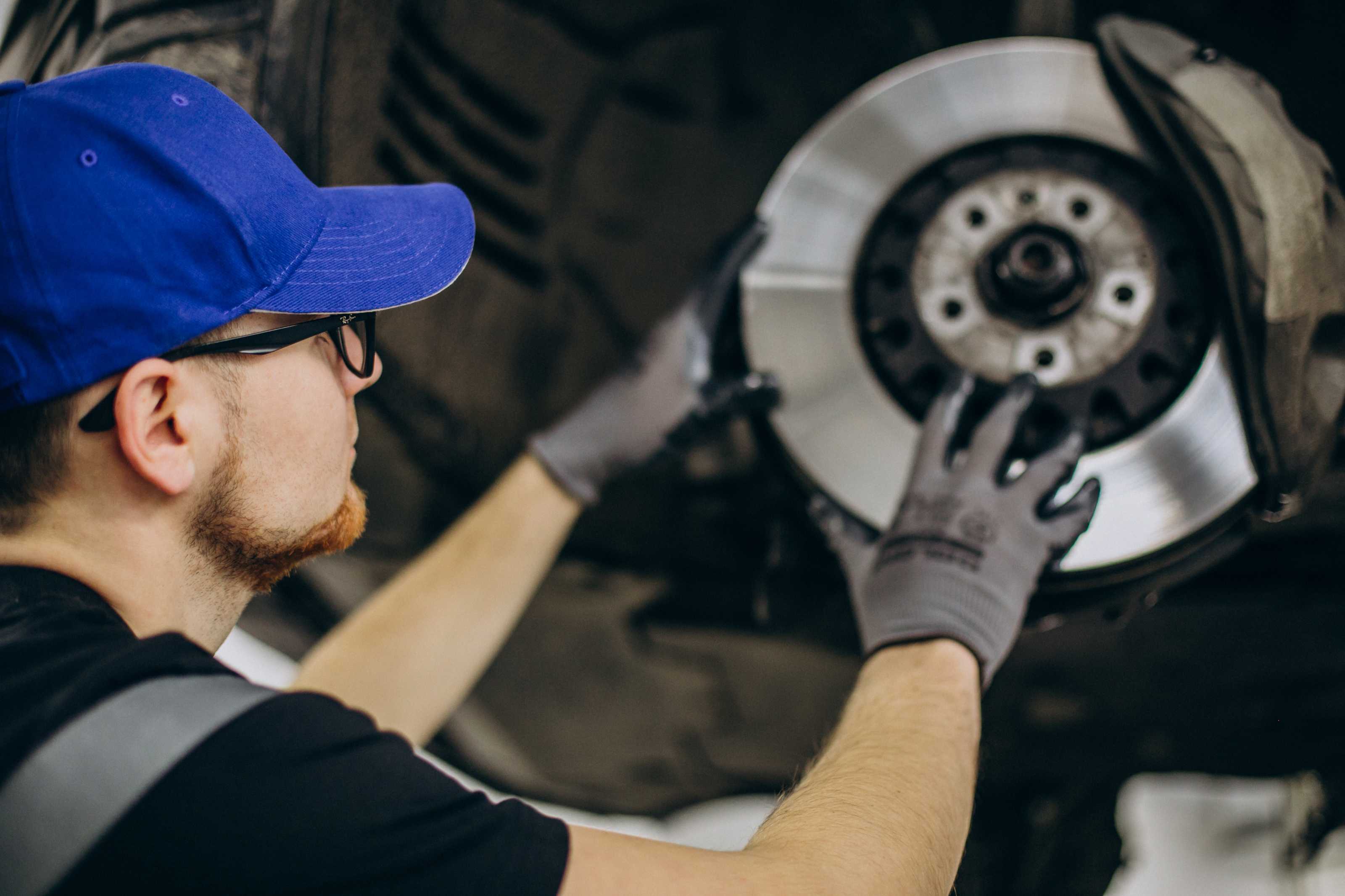 Brake-mechanic-img (3) Signs It’s Time to Replace Your Brake Pads